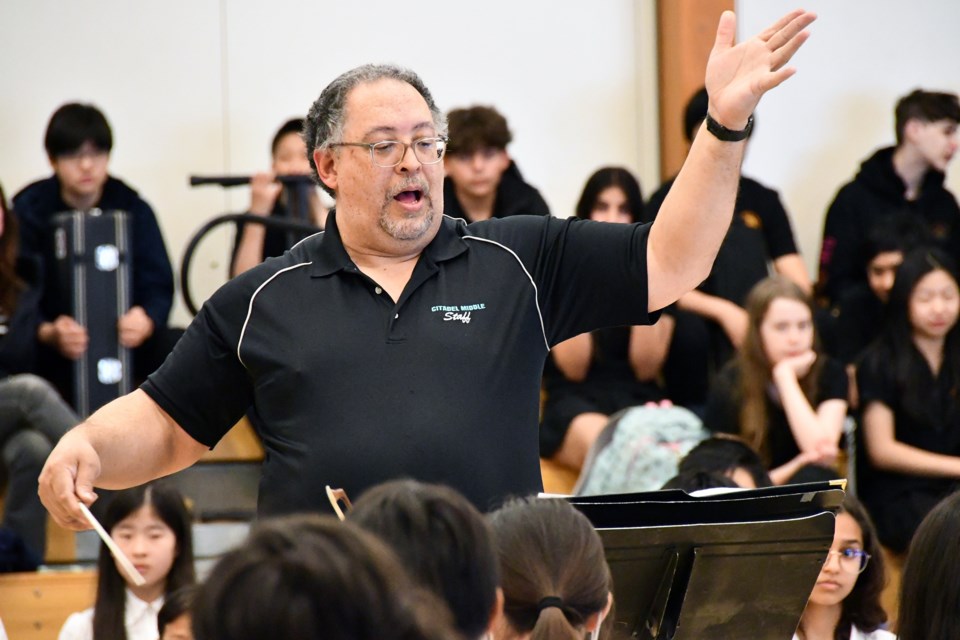 Citadel Middle band teacher Ralph Goring leads his students.