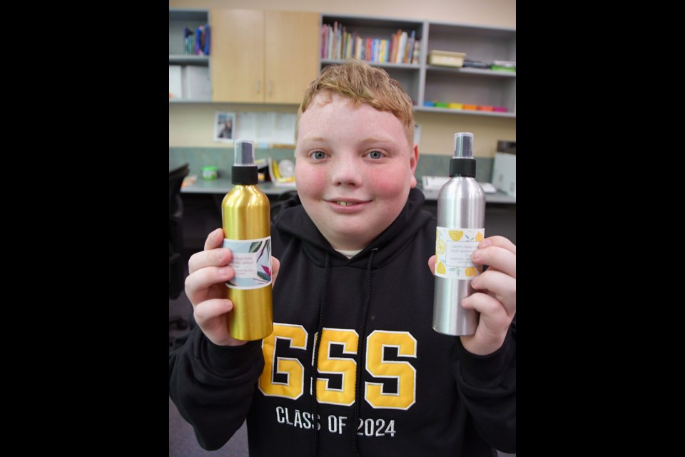 Connor Leighton, a Grade 12 student at Gleneagle Secondary in Coquitlam, shows off a couple of sprays he made for the first Spring Market.