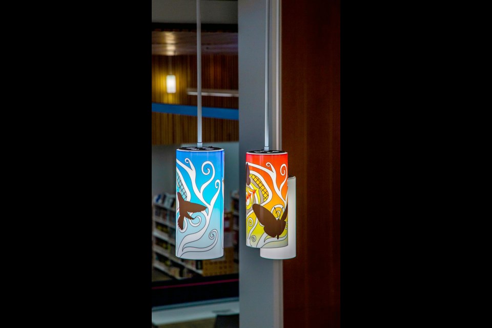 Katzie First Nation artist Rain Pierre (sɬə́məxʷ) — in collaboration with Dusty Yurkin — designed the lamp coverings for the City Centre branch of the Coquitlam Public Library.