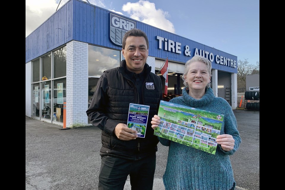 Dean Washington, president of Grip Tire in Port Moody, with Coquitlam artist Rose Kapp who Washington commissioned to create a walking map of Moody Centre for Grip's customers.
