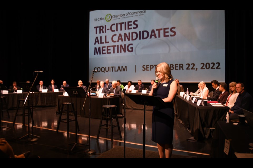 Leslie Courchesne, chief executive officer of the Tri-Cities Chamber of Commerce welcomes the crowd at the 2022 all-candidates meeting at the Evergreen Cultural Centre in Coquitlam.