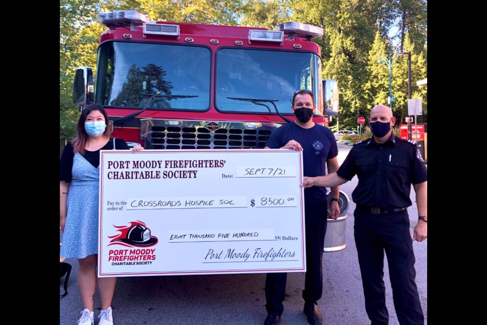 Luka Pavicic, president of the Port Moody Firefighters Charitable Society, with treasurer Jeff Dennis and Jaimie Jeon, Crossroads’ development officer and special events coordinator.