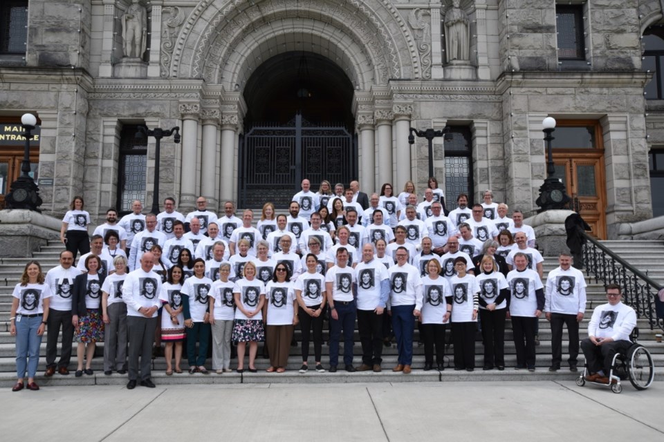BC MLAs wearing the 2022 Terry Fox T-shirts, on the steps of the provincial legislature.