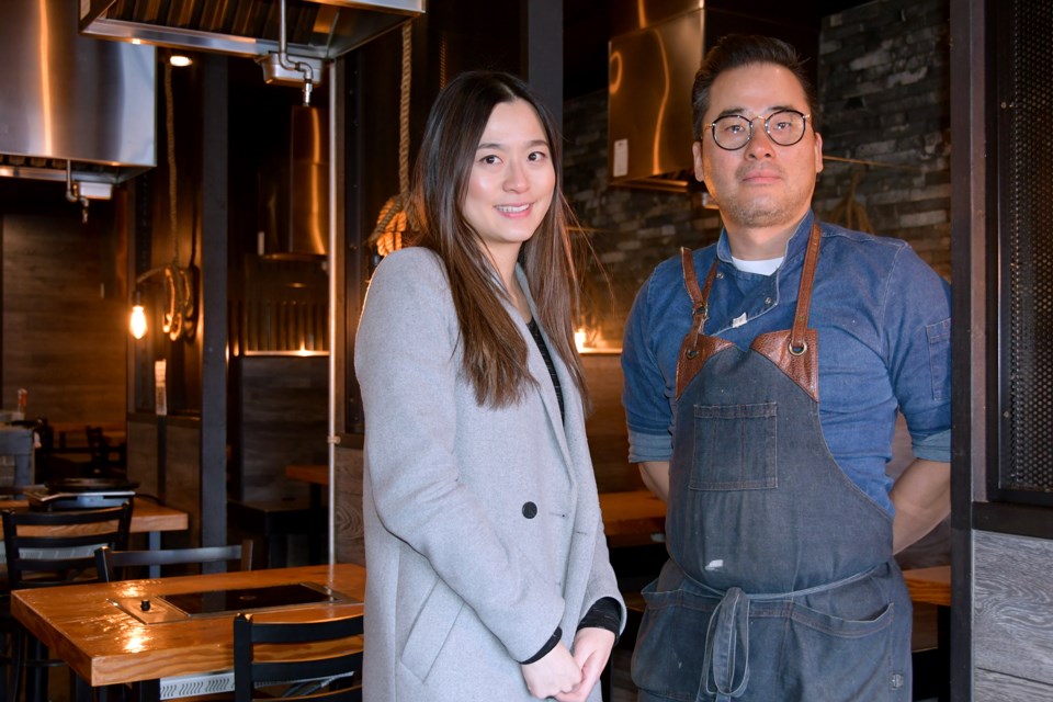 Chloe Wan of the Tri-Cities Chamber of Commerce with Keith Hong of HAAN Korean BBQ in Coquitlam, which is taking part in the Taste of the Tri-Cities Festival for the first time.