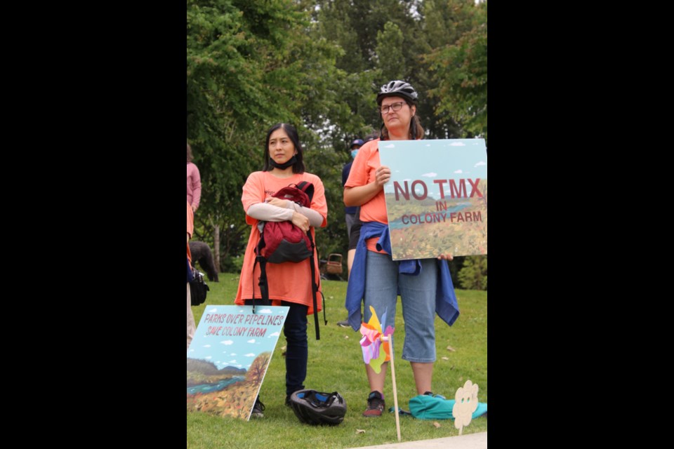 Protestors watch Prime Minister Justin Trudeau leave.