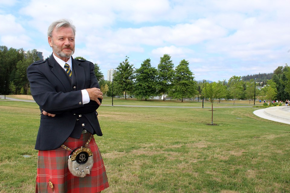 Coquitlam's Mike Chisholm, in his Chisholm tartan kilt, looks over the festival site at Town Centre Park, as he prepared for ScotFestBC: The British Columbia Highland Games.