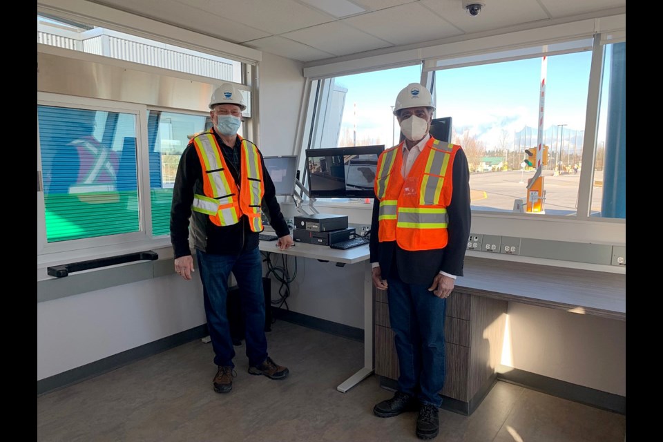 Metro Vancouver board members Jack Froese (zero waste committee) and Sav Dhaliwal (board chair) in a scale station.