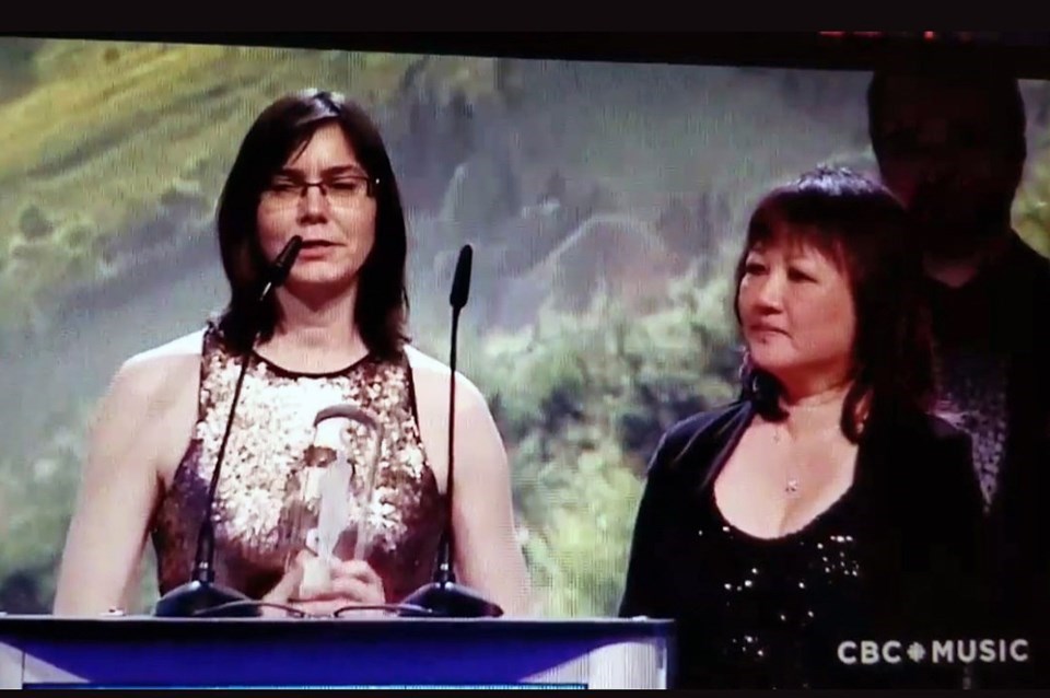 Jocelyn Morlock accepts her Juno with Carol Todd by her side.
