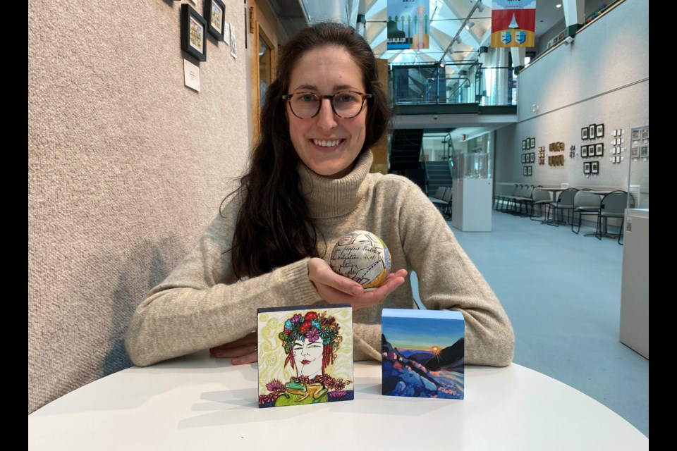 Kim Correia, exhibition program manager at Place des Arts, with gifts from the Positively Petite show and sale.