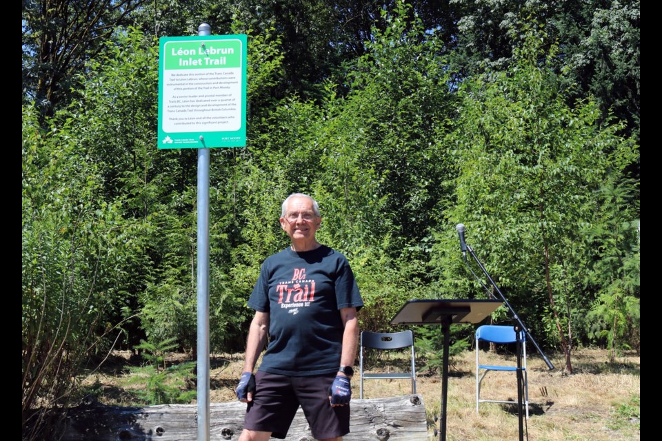  Léon Lebrun stands next to the new dedication sign for Léon Lebrun Inlet Trail on July 14, 2022.