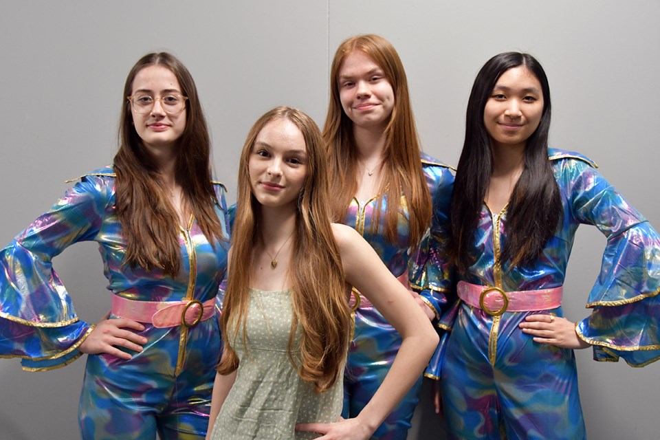 Sophie and The Dynamos (left to right): Kira Egery-Haley (Tanya); Abegail Avramenko (Sophie); Chloe Summer (Donna); and Selina Jia (Rosie). Mamma Mia! runs at Gleneagle Secondary in Coquitlam in May 2024.