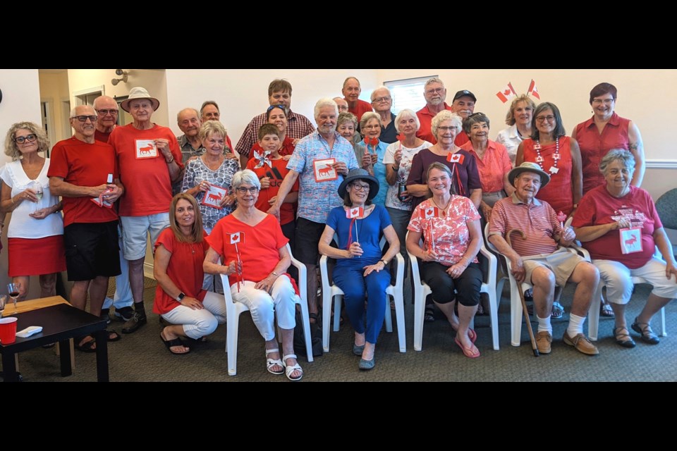 The group photo of Riverlane Estate residents in Port Coquitlam in Canada Day party mode.