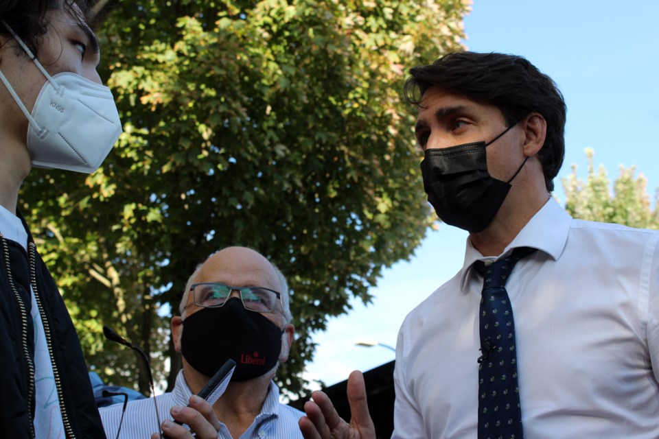 Justin Trudeau is interviewed with Coquitlam-Port Coquitlam MP Ron McKinnon on Sept. 13, 2021, in Port Coquitlam.