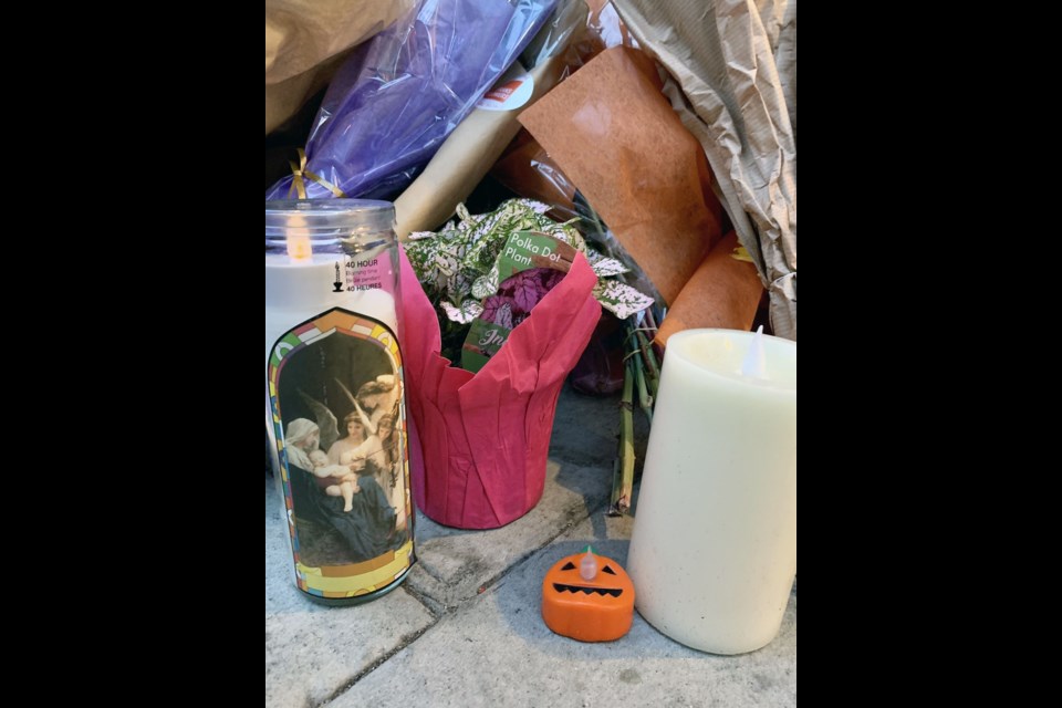 A memorial for Ridge Meadows RCMP Const. Frederick "Rick" O'Brien is outside the Evergreen building where he was fatally shot while executing a search warrant on Friday, Sept. 22, 2023, with two other RCMP officers.