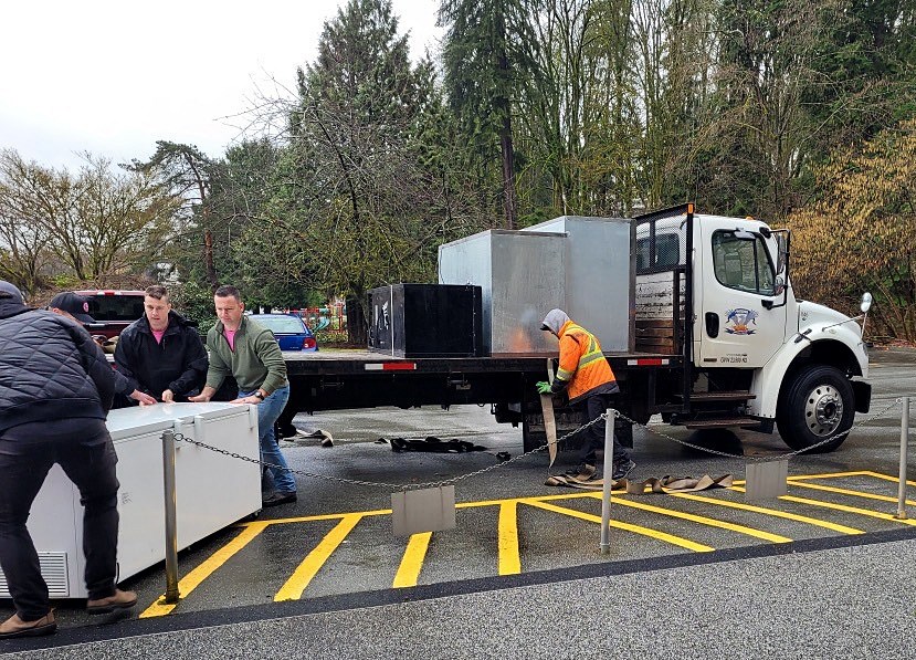 With the help of Phoenix Truck and Crane, and Port Coquitlam firefighters, The People's Pantry in Port Coquitlam moved today, Feb. 28, 2024, from Elks Hall to its new location by the Port Moody legion.