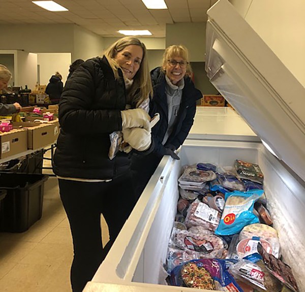 Volunteers load up the hampers with recovered food.