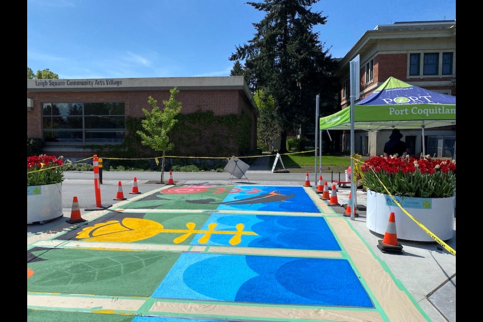 Mural painting in progress on McAllister Avenue. It was completed in time for Port Coquitlam's May Day festival.