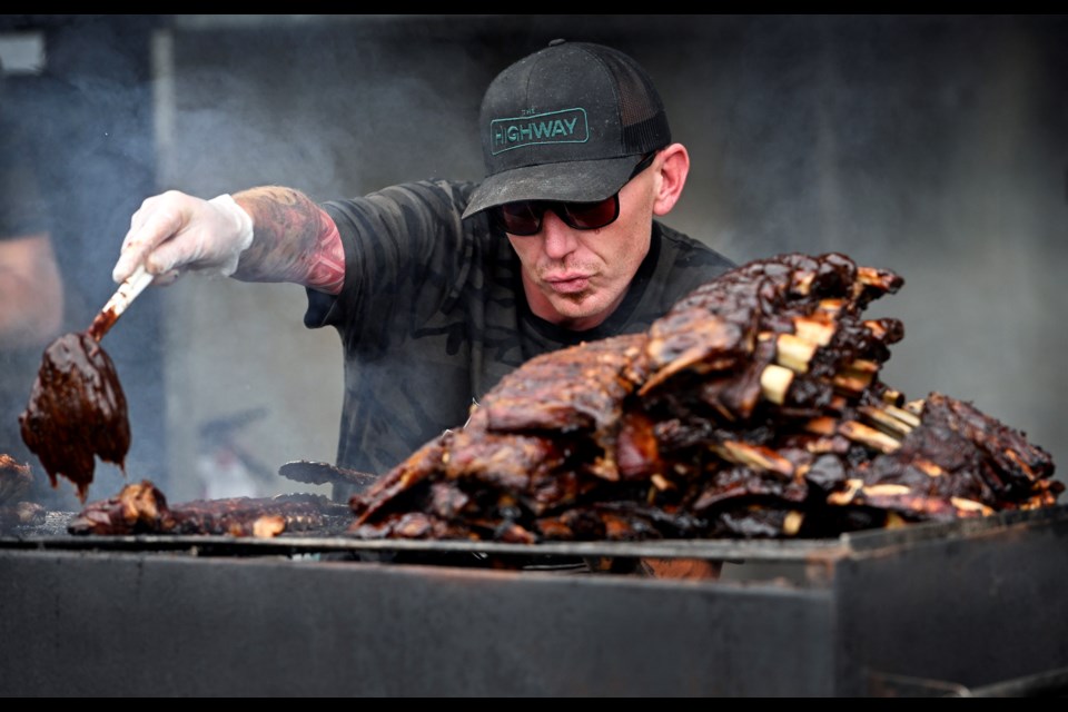 Scott Rawlinson of Grizzly BBQ prepares the ribs at Port Moody's Ribfest.


