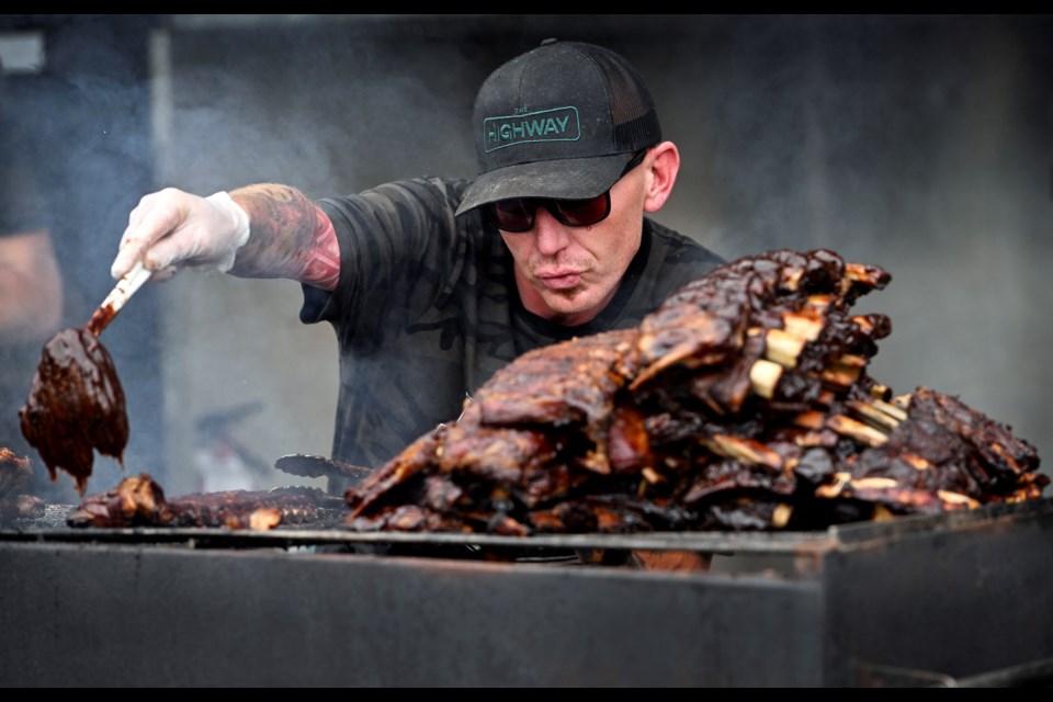 Scott Rawlinson of Grizzly BBQ prepares the ribs at Port Moody's Ribfest.


