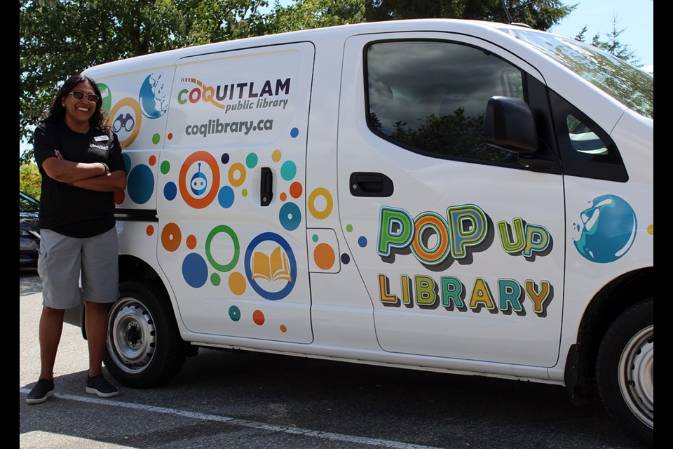 Ann Johannes, the Coquitlam Public Library's community development liaison for programming and community connections, with the POP van.