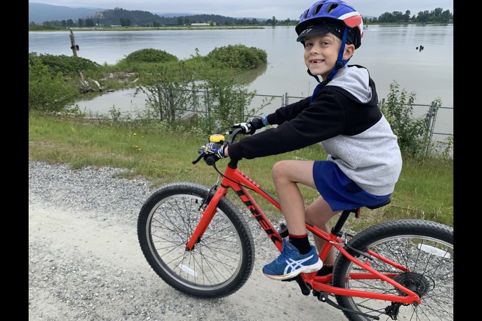 Cycling the gravel paths on the top of Coquitlam and Port Coquitlam dikes is a fun activity for the family.