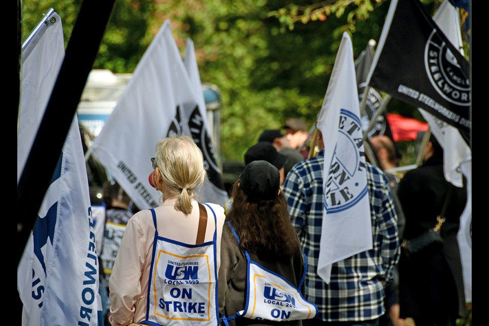 Union workers strike outside their company, Uni-Select, Bumper to Bumper, during a lunchtime rally on Sept. 18, 2024.