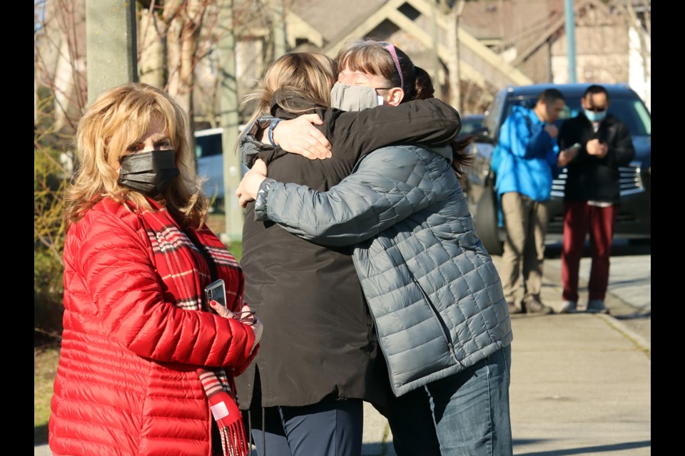 Searchers looking for Trina Hunt console each other at a command centre that's coordinating a volunteer effort to find the missing 48-year-old woman from Port Moody.