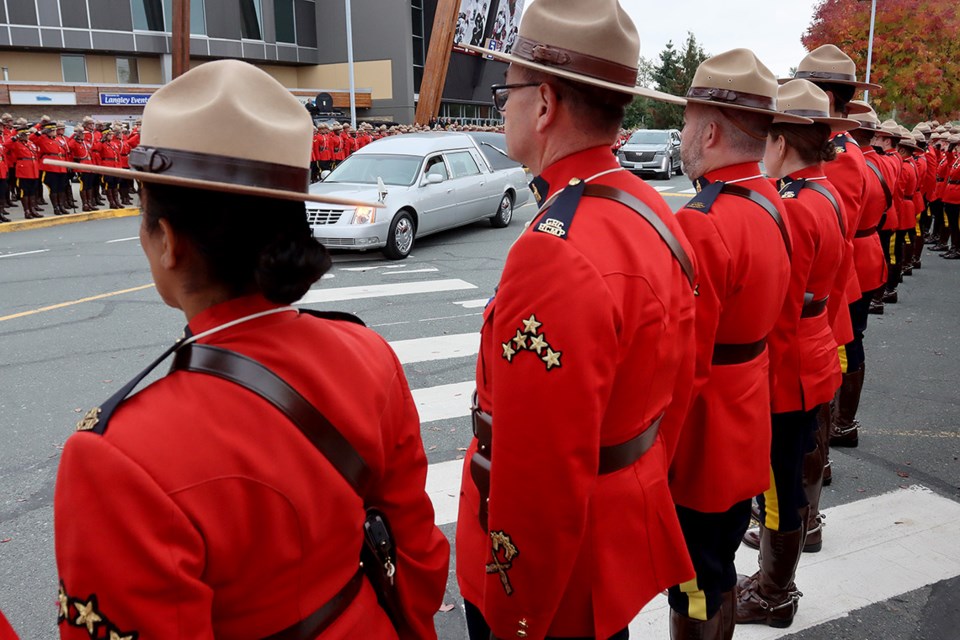 Members of Coquitlam RCMP pay their final respects to Ridge-Meadows RCMP Const. Rick O'Brien following his regimental funeral Wednesday at the Langley Events Centre.
