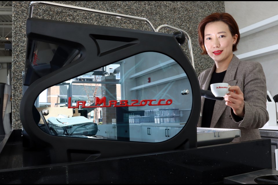 Bridgette Hyun with the espresso machine at her C Market Coffee shop that been recognized as the best new business at the PoCo Best Biz Awards.