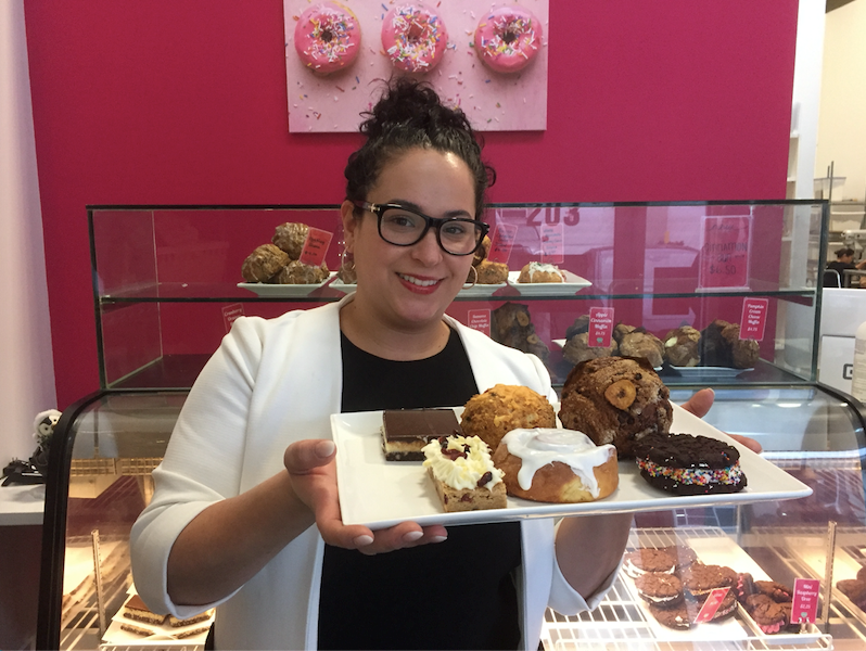 Delish owner Jenna Fidanza with some of her best-selling baked goods. Fidanza will expand to open an Italian-inspired café in February.