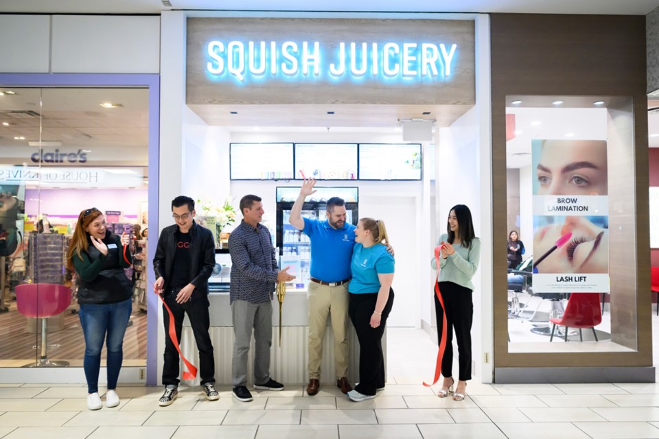 The ribbon is cut at Squish Juicery's official grand opening inside Coquitlam Centre.