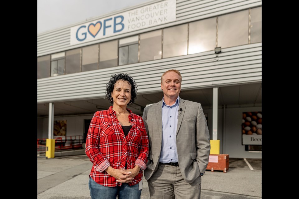 Tru Earth's Brad Liski, right, pays a visit to the Greater Vanoucver Food Bank.