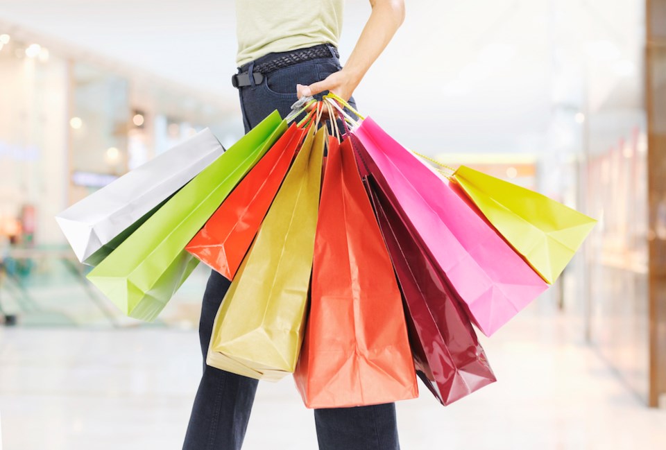 woman-carrying-shopping-bags-getty-images