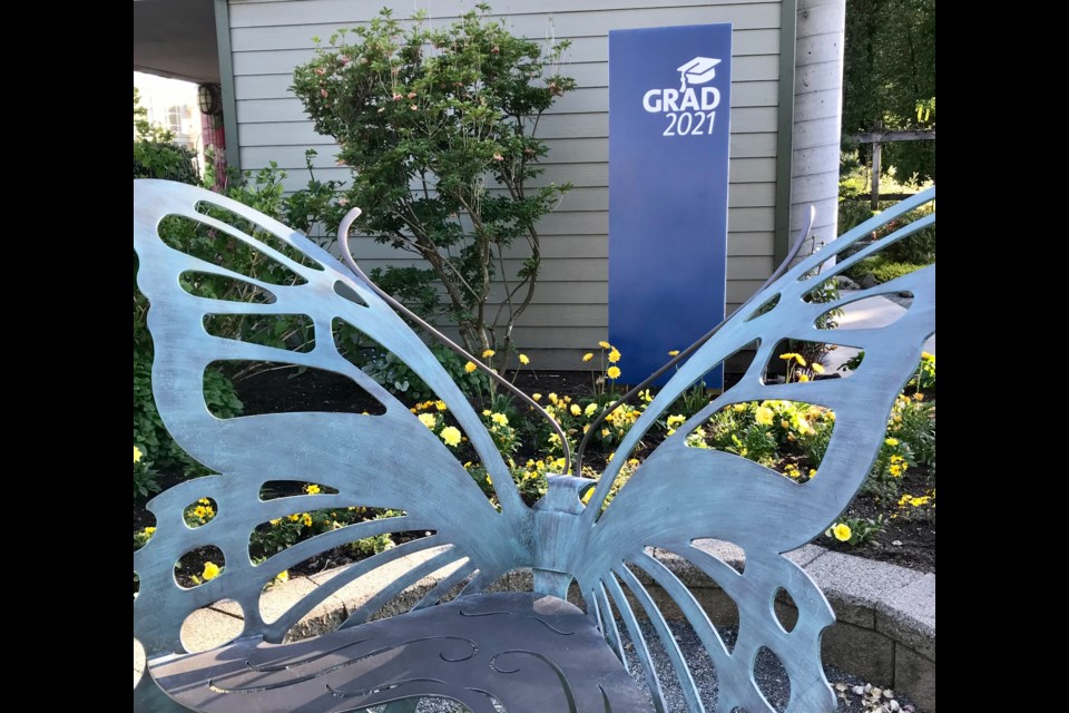 A beautiful butterfly marks the spot where 2021 grads can get their photo taken at the Inspiration Garden in Coquitlam.