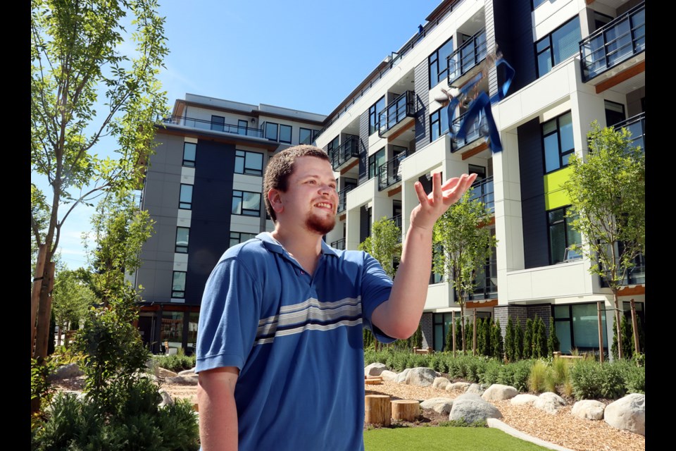 MARIO BARTEL/THE TRI-CITY NEWS 
Andrew Wiseman is excited to have the keys and electronic entry fob to his very own place for the first time in his life. Wiseman, 37, is living in one of six affordable, accessible units managed by Kinsight, a social service agency that assists families and individuals with developmental challenges, in the new George condo complex in Port Moody.