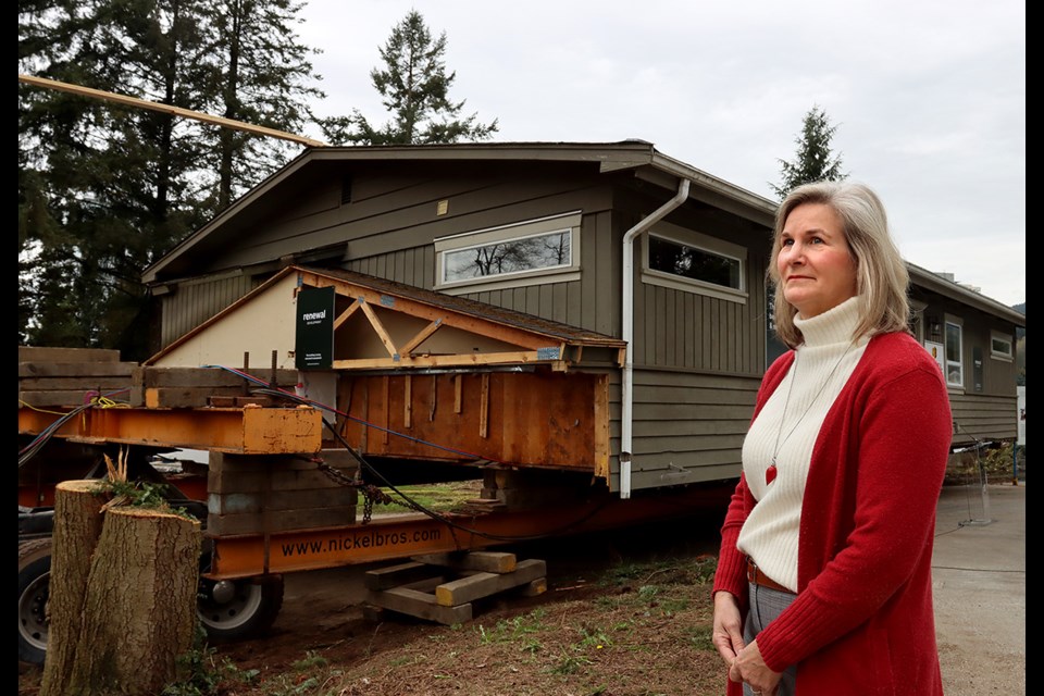Wendy Kinloch says goodbye to the house in Port Moody's old Coronation Park neighbourhood her family called home for 34 years. The home is one of 10 scheduled to be moved to the shishalh Nation near Sechelt at the neighbourhood is redeveloped.