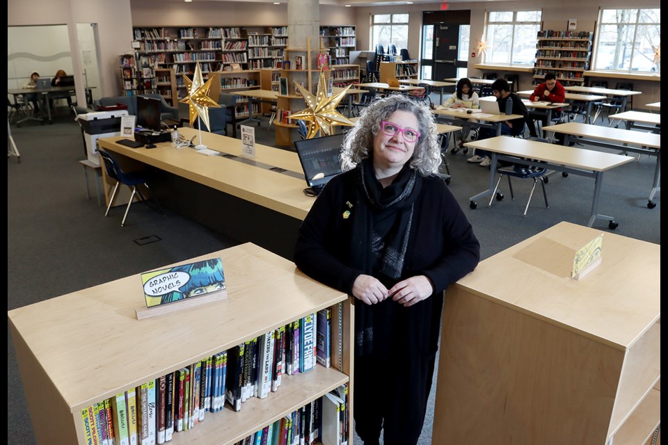 Susan Henderson, librarian at Riverside Secondary in Port Coquitlam, shows how recent renovations have transformed the space into an active learning centre with moveable tables and cabinets that allow it to be reconfigured.
