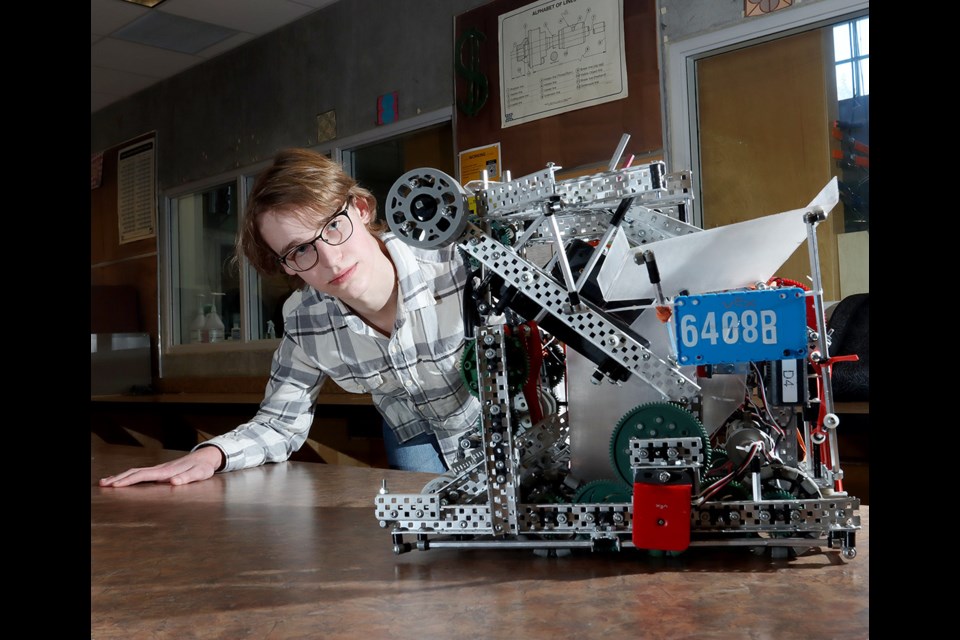William Mostrenko shows off the robot built by his robotics team at Heritage Woods Secondary School will be taking to the VEX robotics world championships in Dallas, Texas.