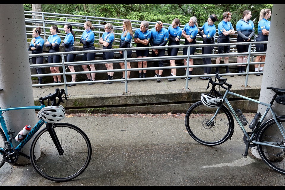 Riders in the Tour de Coast and Tour de Valley wait to enter the gym at Scott Creek Middle School in Coquitlam for the official launch of the annual fundraising rides for childhood cancer research that's scheduled to take place Sept. 13-20.