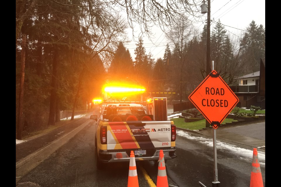 North Road closed in Coquitlam to permit work crews to clean out a sewer pipe.
