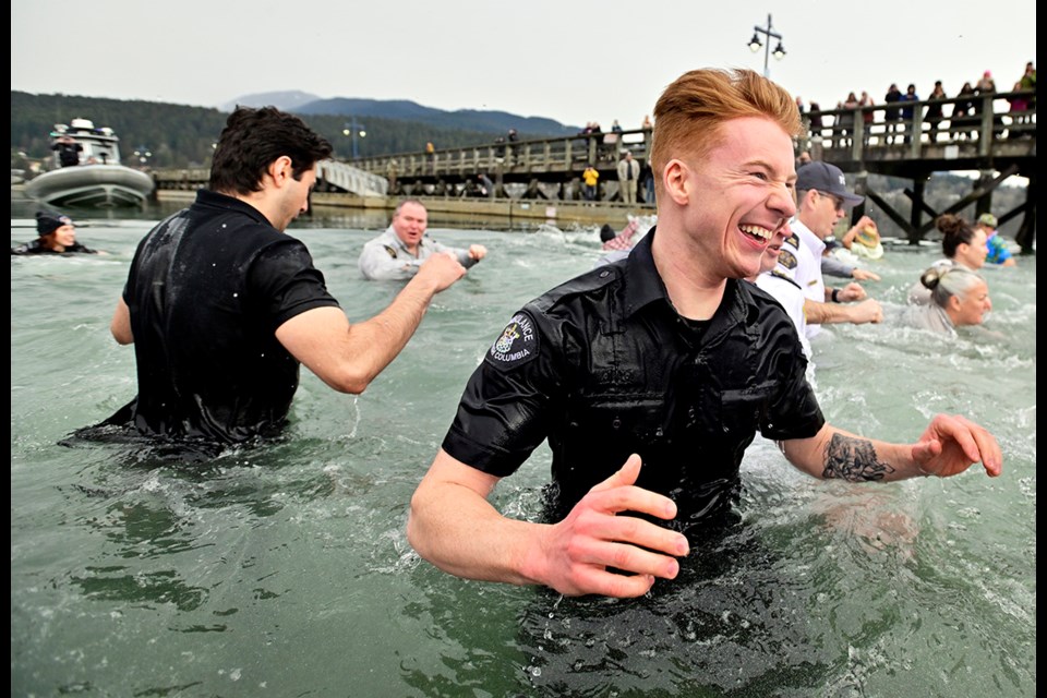 Port Moody Police, as well as emergency personnel and business leaders take a dip in the Port Moody Inlet to support the Special Olympics. 


