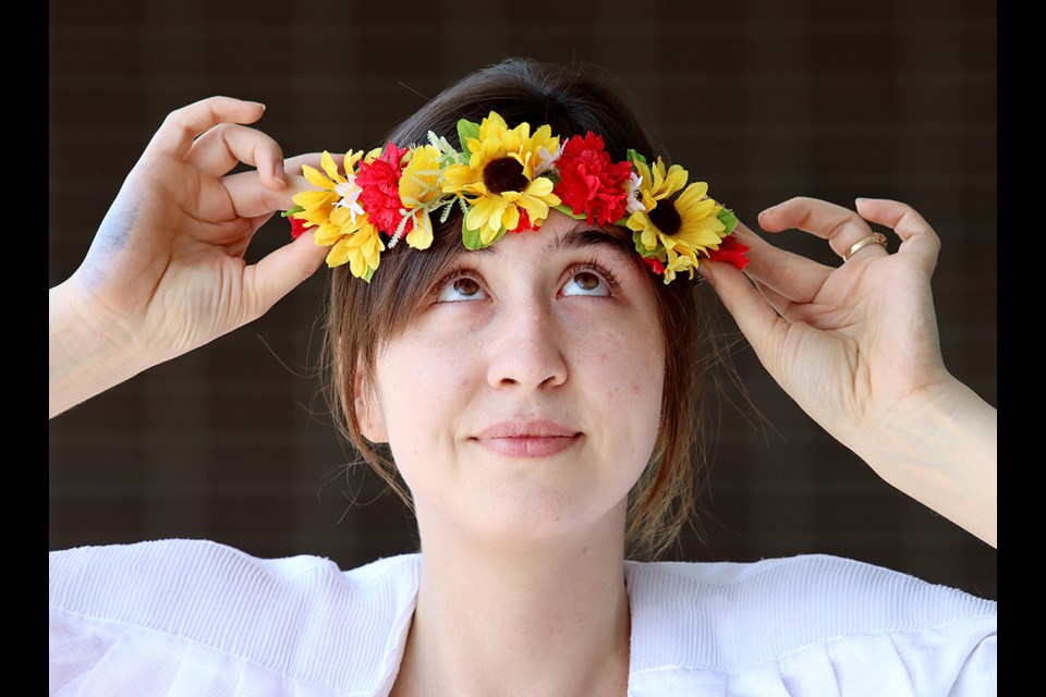 Emma McLaren, president of the Polonez Tri-City Polish Association, adjusts her traditional flower crown in advance of the May 28 B.C. Polish Festival to be held at the plaza at the new Port Coquitlam Community Centre.