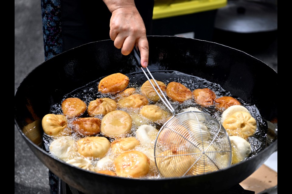 Dungan Houseâs hoshan are prepared at the inaugural BC Dumpling Festival at Town Centre Park, hosted by the Asian Arts and Culture Society.



