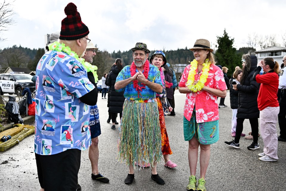 Rotary club members tried to stay warm ahead of taking the plunge.