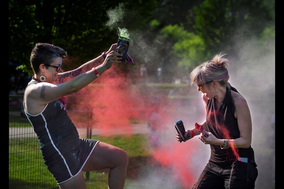 Participants throw coloured powder at Colour Fest, a gathering to celebrate the South Asian festivals of Holi and Vaisakhi, Saturday (May 20) at Coquitlam's Town Centre Park.
