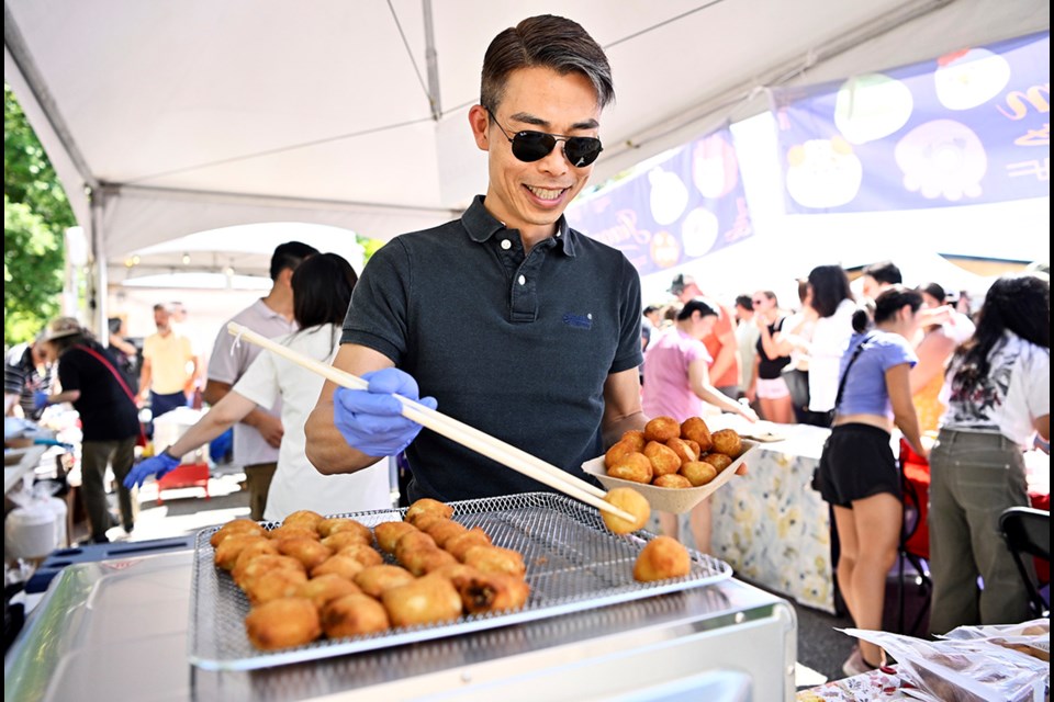 Handcrafted dumplings are served up at the at Jiaozi.com food booth, Saturday at the BC Dumpling Festival held in Coquitlam's Town Centre Park.