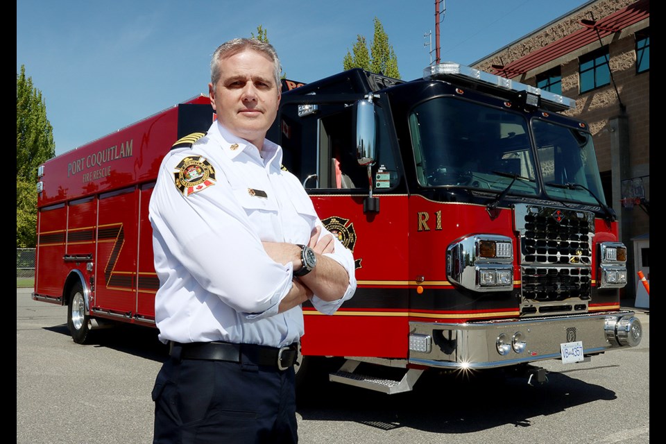 Port Coquitlam fire chief Robert Kipps shows off the department's new rescue truck.