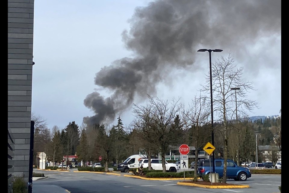 Smoke from an apparent fire near Coquitlam's City Centre on Feb. 22, 2023.