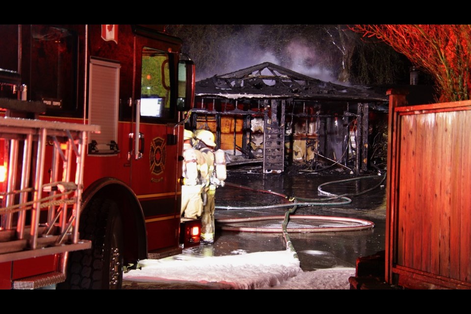 Coquitlam Fire Rescue extinguished a fire that spread between two River Springs neighbourhood homes the night of Feb. 16, 2023.