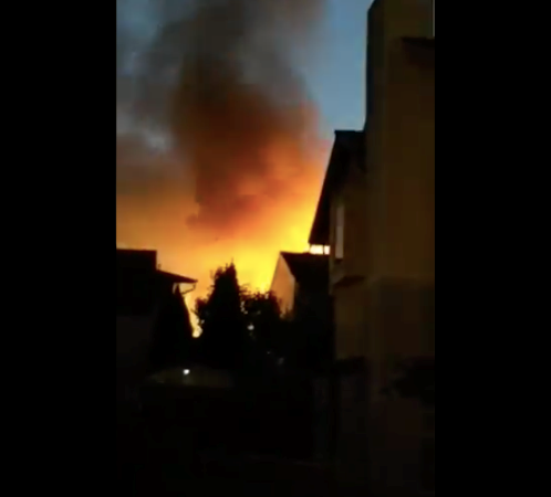 Flames light up the night sky from a house fire in Coquitlam on Saturday night.